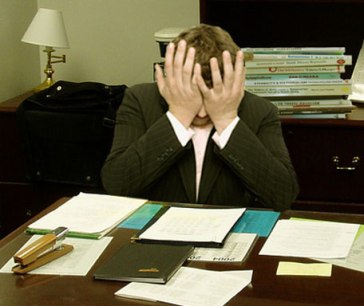 By LaurMG. (Cropped from "File:Frustrated man at a desk.jpg".) [CC-BY-SA-3.0 (http://creativecommons.org/licenses/by-sa/3.0)], via Wikimedia Commons